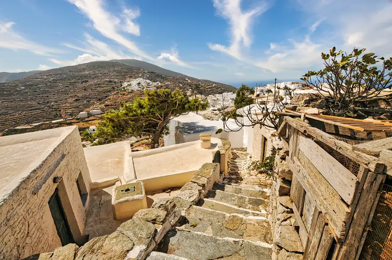 Whitewashed houses and a stairway in Kastro overlooking the Aegean on Sikinos
