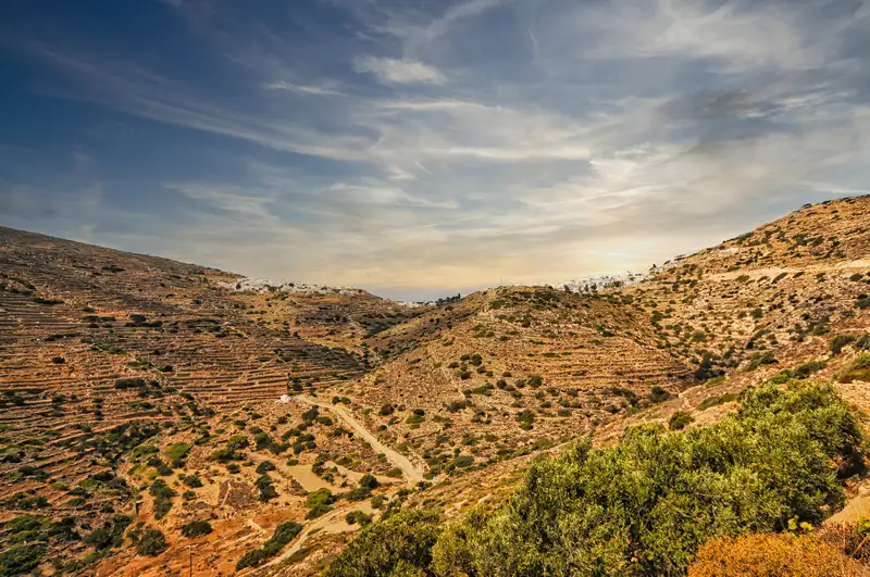 Panoramic view of the terraced hills and village of Sikinos island