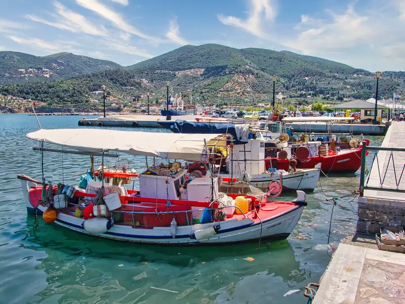 Colourful Skopelos fishing boats loaded with nets and gear at the harbour