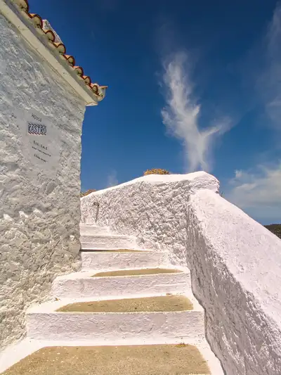 Whitewashed steps leading up toward a chapel in Skopelos town