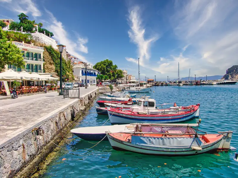 Fishing boats moored along the stone quay of Skopelos town 