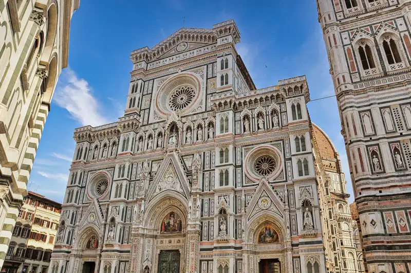 The marble facade of Florence Cathedral, Santa Maria del Fiore, beside Giotto's bell tower