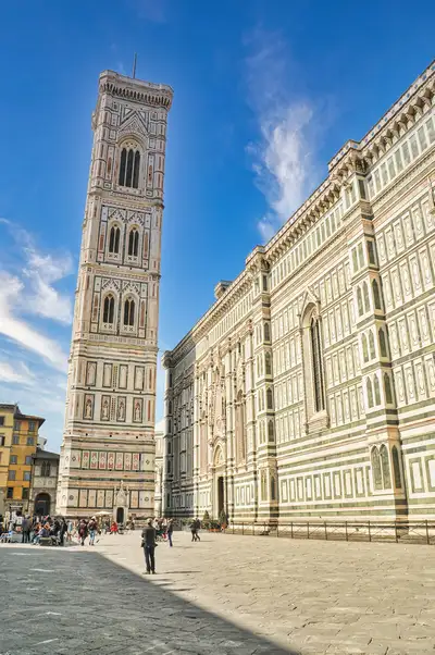 The tall campanile of the Duomo in Florence seen from Piazza del Duomo