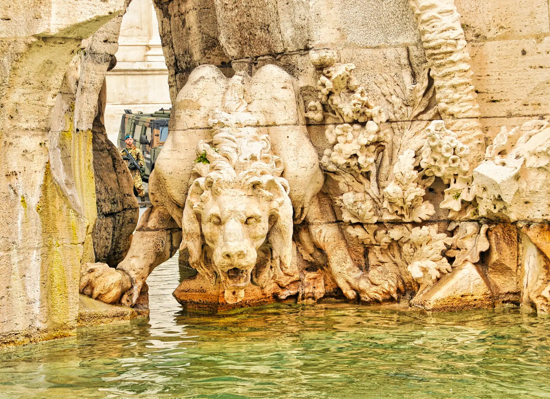 Carved stone lion and sea horse detail at the base of the Fountain of the Four Rivers in Rome