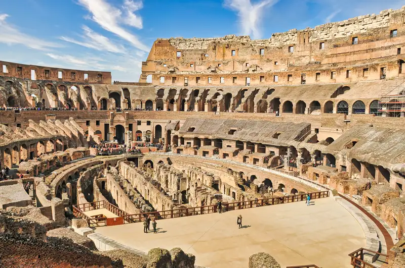 Inside the Colosseum in Rome, looking down over the ruined arena and underground chambers
