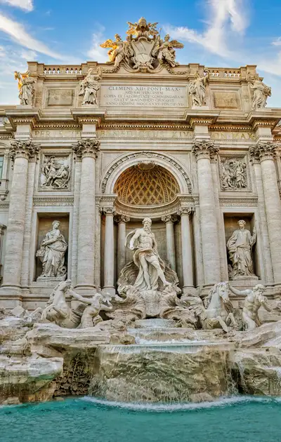 The white marble figures and falling water of the Trevi Fountain