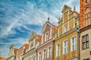 Row of colorful gabled merchant houses with ornate facades in the old market square of Poznan, Poland