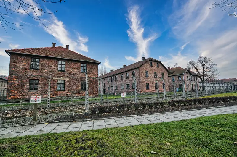 Preserved buildings and perimeter fence at the Auschwitz-Birkenau State Museum