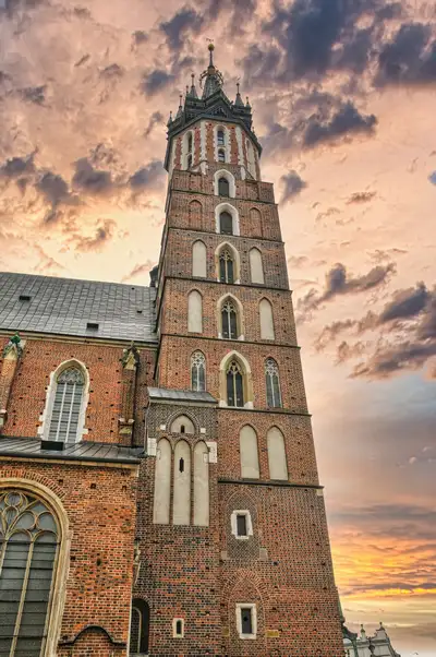The tall gothic tower of St Mary's Basilica in Krakow seen from below