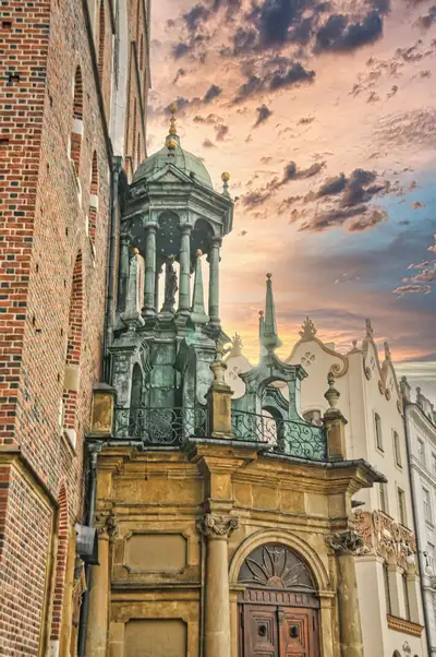 Detail of a brick church wall and domed canopy in Krakow's Old Town