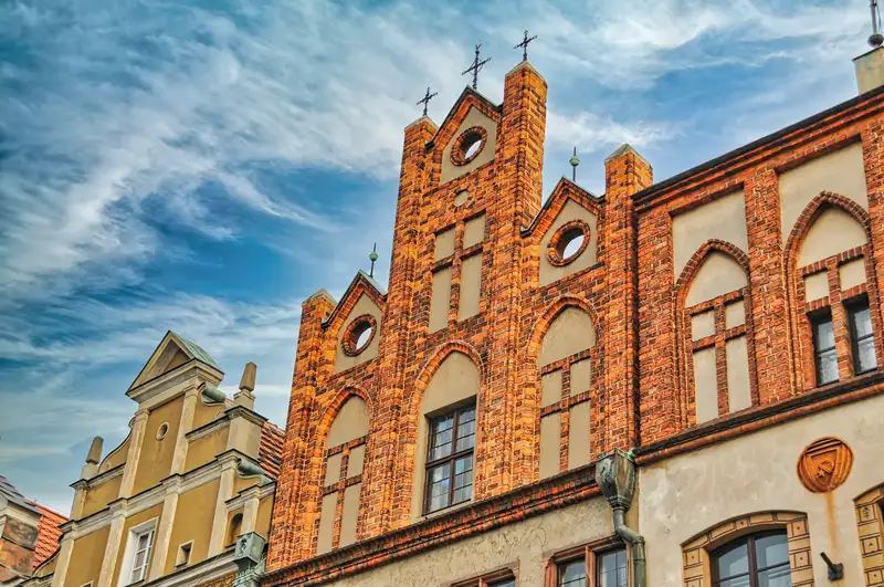 Gothic brick gable with crosses on a building at the Old Market Square in Poznan