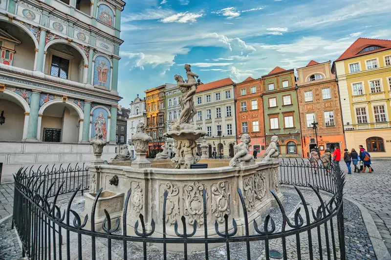 Proserpina Fountain on the Old Market Square in Poznan with colourful townhouses behind