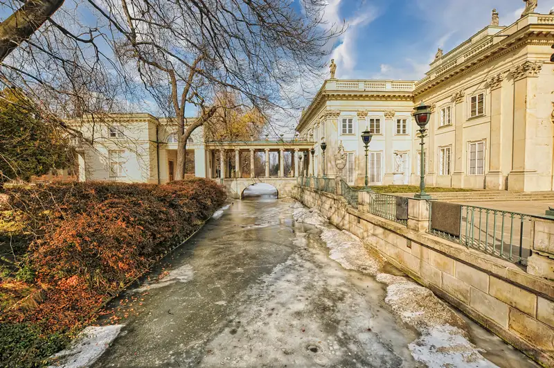 The Palace on the Isle and its colonnade across the water in Łazienki Park