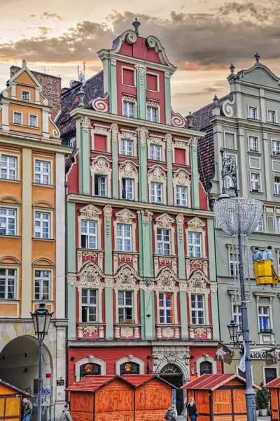Painted baroque façades in the Rynek of Wroclaw with wooden market stalls